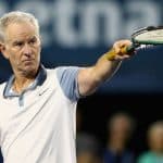 John McEnroe holding a tennis racket